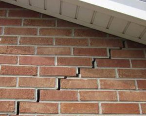 Stair Step Exterior Brick Cracking corrected with deep driven steel pier